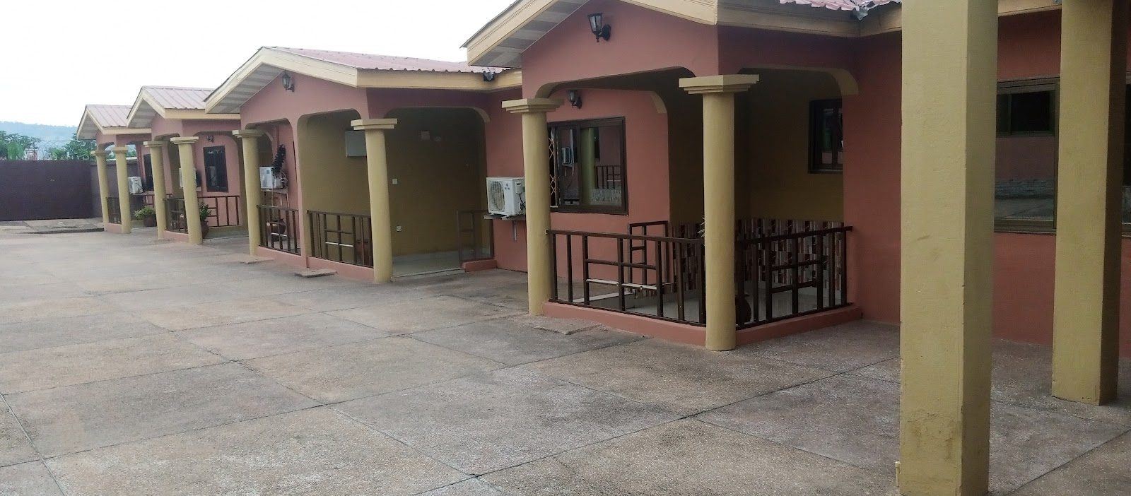 Covered guest-room entrances around MagJohn Hotel's compound
